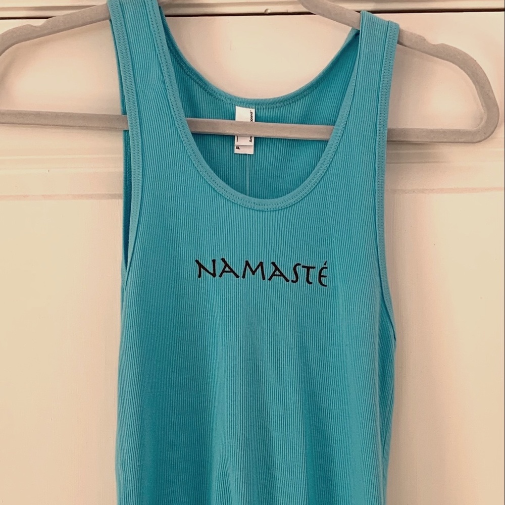 sleeveless ribbed tank top with "namaste" logo